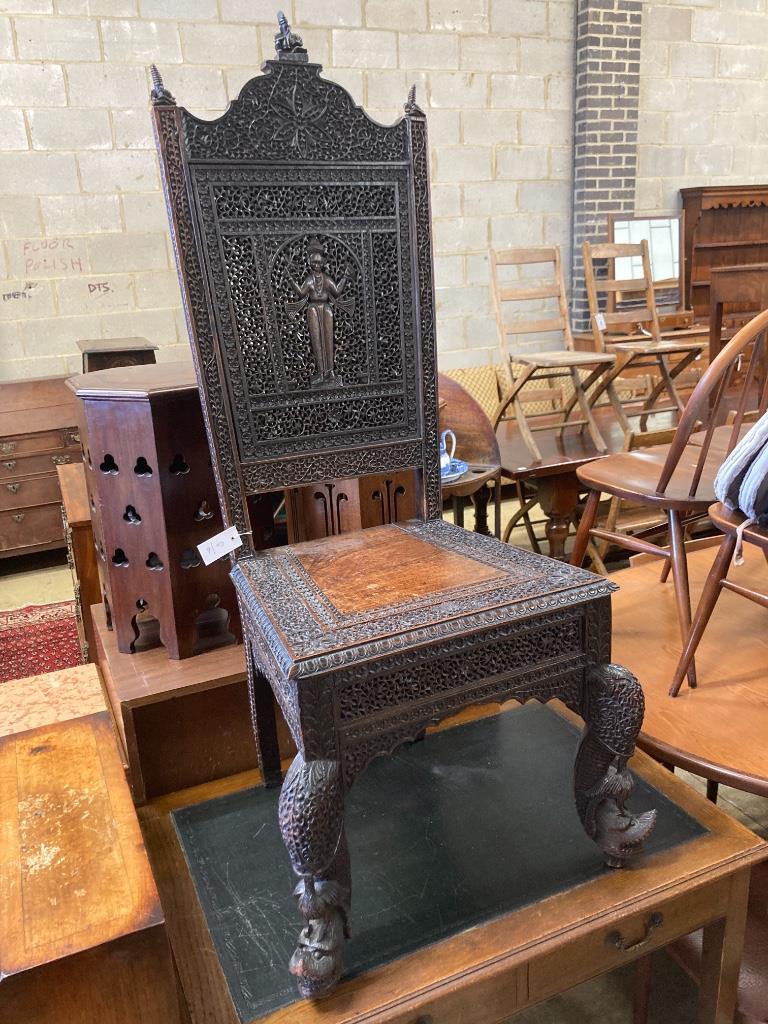 A 19th century Burmese carved hardwood side chair, width 55cm, depth 48cm, height 128cm